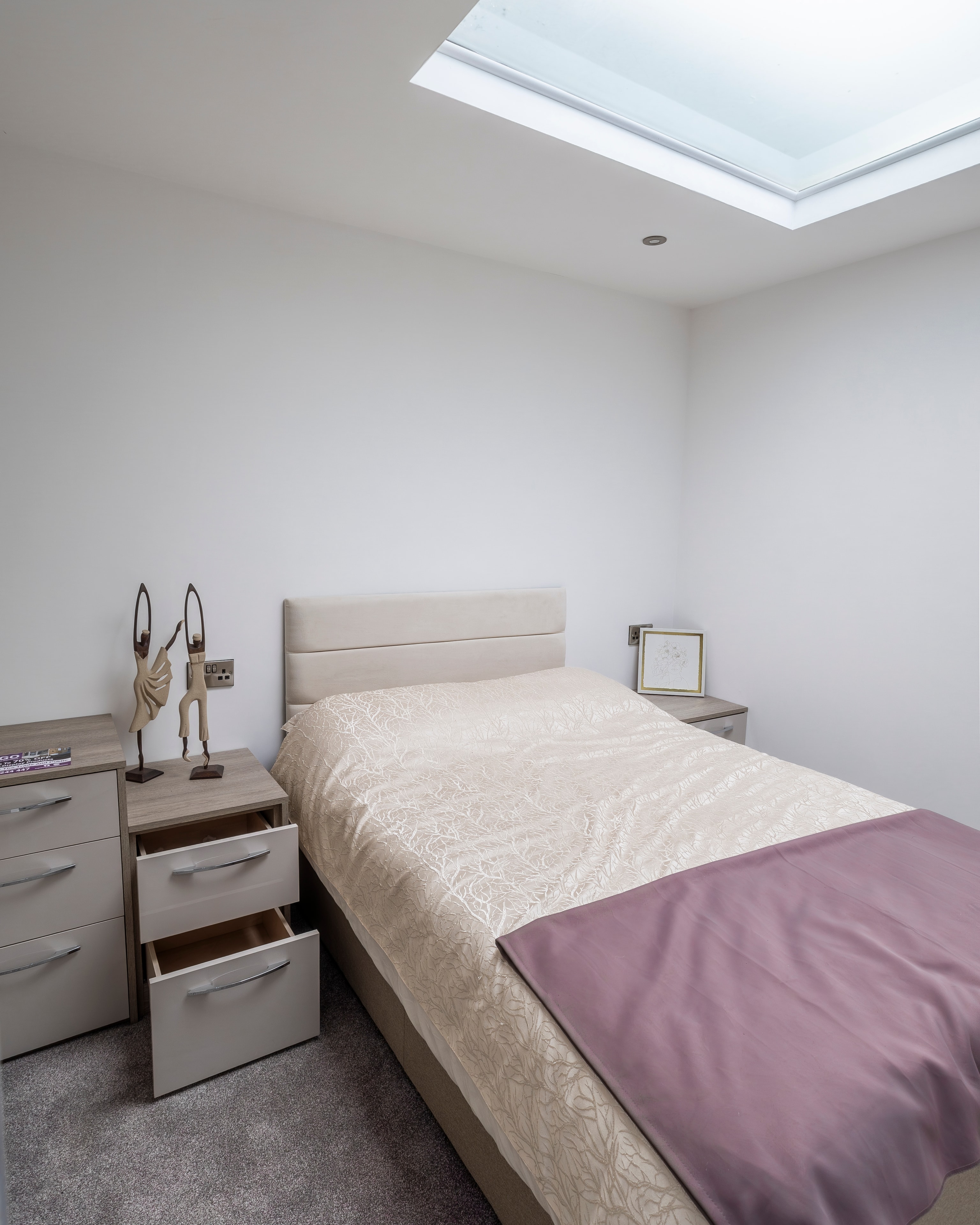Pastel grey bedroom with pink accents